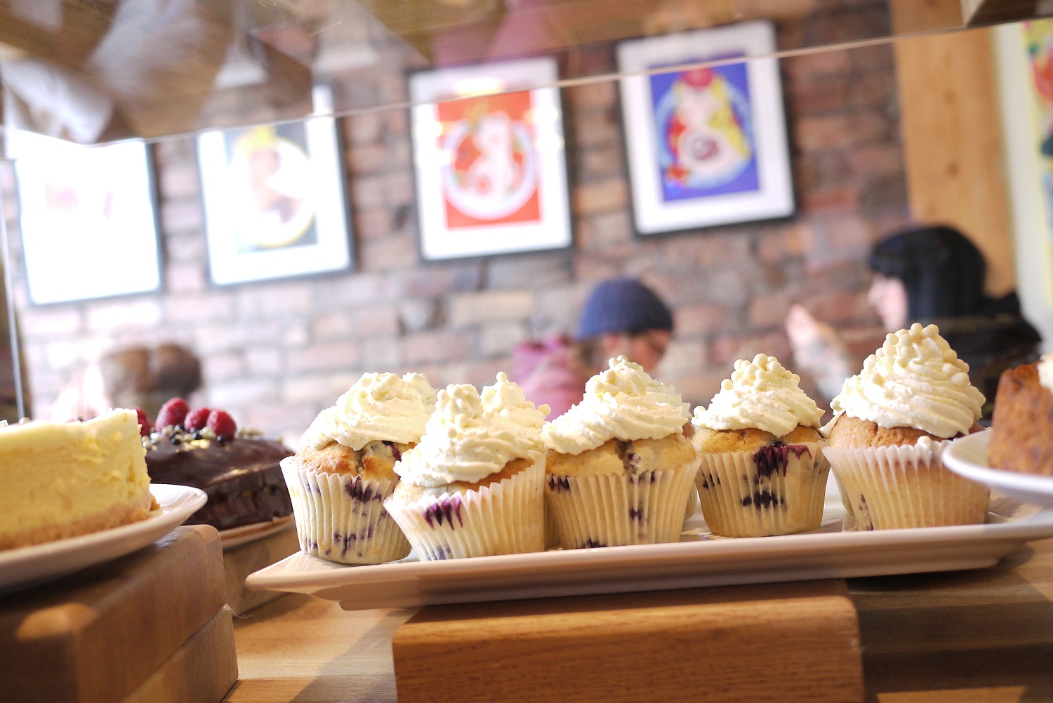 A row of cupcakes on the counter at Made by Jonty.